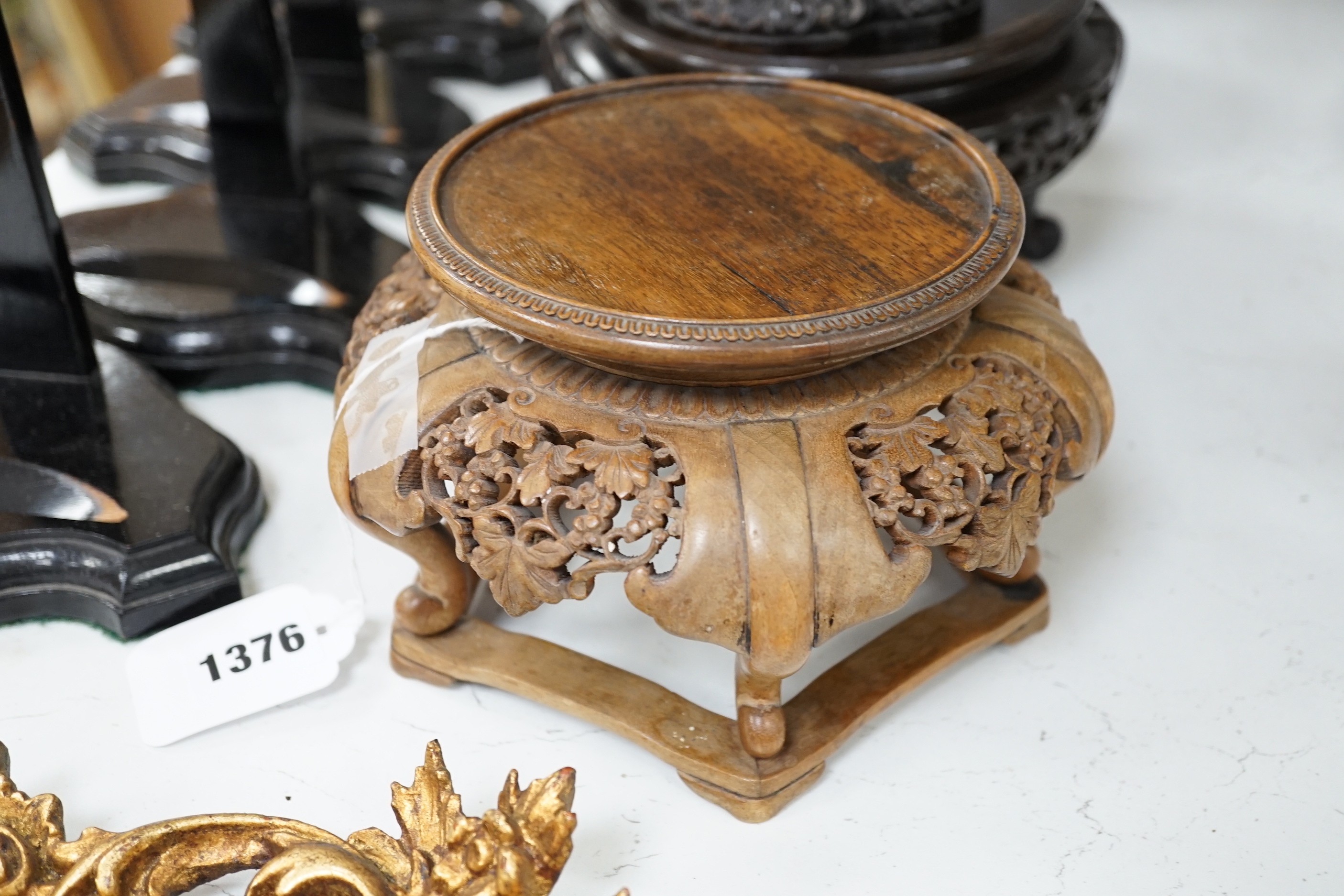 An 18th century Chinese export famille verte plate, Kangxi period Japanese carved wood stand and other various Chinese wood stands